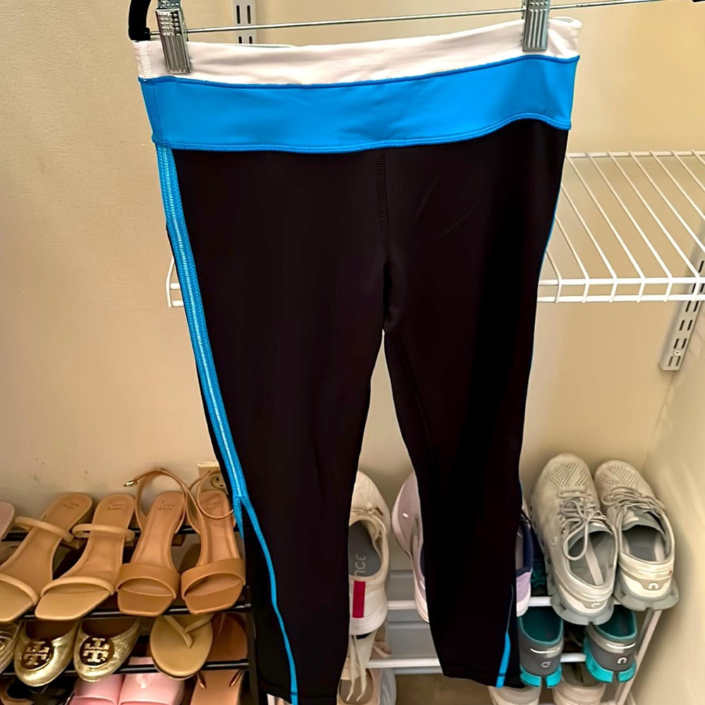 Women’s Lululemon long leggings, black and turquoise. Size 4. Moderately used.